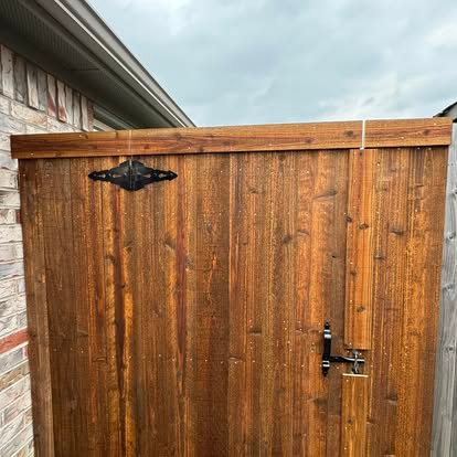 Stained gate with decorative strap hardware